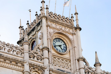a great round clock that adorns the highest part of the building with impressive architecture