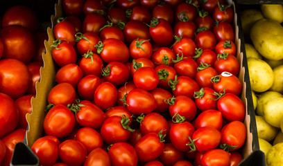 Seasonal and exotic fruits and vegetables on the food shelf in the supermarket