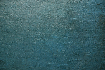 Texture background plastered wall painted in trendy shaded spruce color