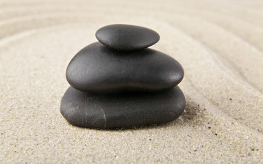 Obraz na płótnie Canvas stones on sand for relaxation as background