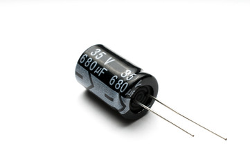 Electrolytic capacitor isolated on white background - obrazy, fototapety, plakaty
