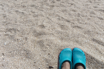 Blue sandals on the beach 