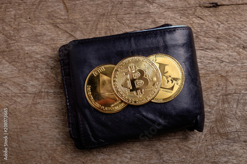 Gold Physical Bitcoin Litecoin And Ethereum Coins On Black Leather - 