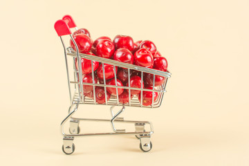 juicy cherry in a shopping cart, fresh berry harvest