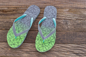 Flip flops sandals on wooden background