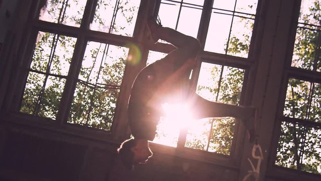 epic slow-motion backflip with long airtime in the sunset 