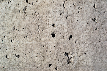 Texture of a concrete wall with holes
