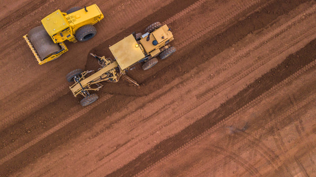 Aerial top view Tractor and Earthmoving at work.