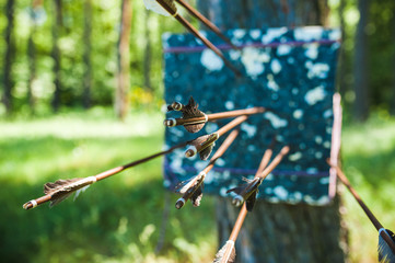 Archery target and arrows.
