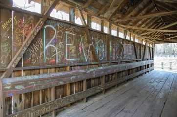 Graffiti along the inner walls of the Pisgah Covered Bridge over the little River in Randolph County , NC