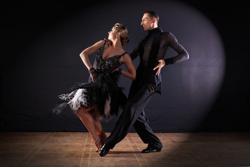 dancers in ballroom isolated on black background