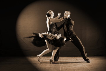 dancers in ballroom isolated on black background