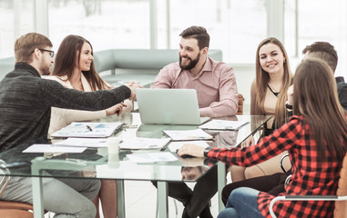 Fototapeta premium handshake financial partners and business team in the workplace