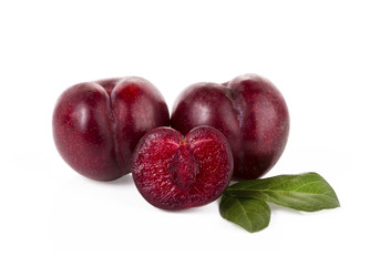 plums isolated on white