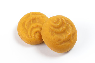 Gurer Sandesh evaporated milk sweet with brown sugar on white background