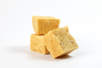 Flaky sweet Soan papdi  patisa son papri sohan papdi shonpapri on white background