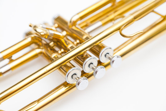 gold trumpet on white background