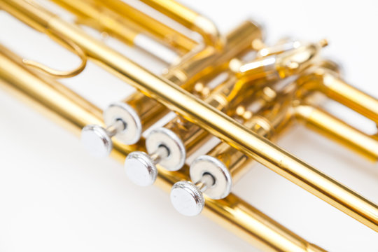gold trumpet on white background