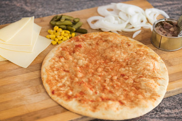 Beautiful and delicious homemade pizza with melted cheese, pickles, onion, green corn and tomato paste. Pasta made in a wood oven in Brazilian or Italian style