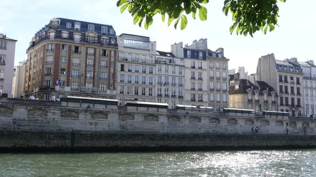 Beautiful Paris buildings facades of Latin quarter on embankment of river Seine channel