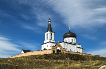 Fototapeta na wymiar Orthodox monastery against the blue sky.
