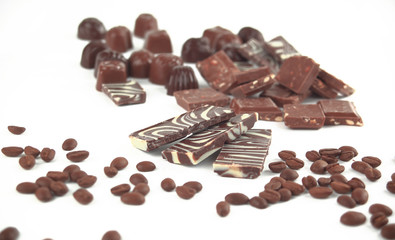 close up.set of chocolate bars and coffee beans. isolated on whi