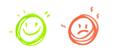 One round green happy face and one round red sad face painted in highlighter felt tip pen on clean white background
