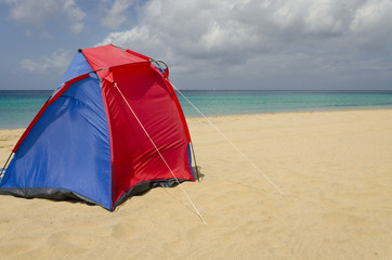 A colorful tent on the beach