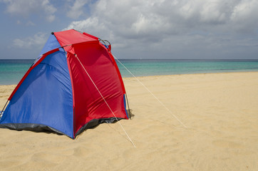 Naklejka premium A colorful tent on the beach