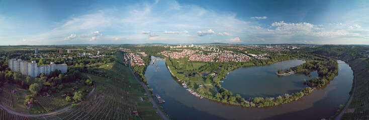 Panoramic aerial landscape shot of the river neckar with urban cityscape and lake with vineyards