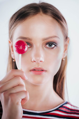 Sexy woman with red lips holding lollipop, beauty closeup