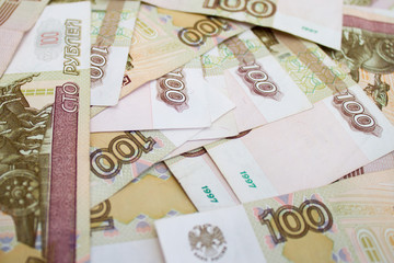 business, finance, saving, banking concept - close up bundle of money Russian Banknotes one hundred rubles