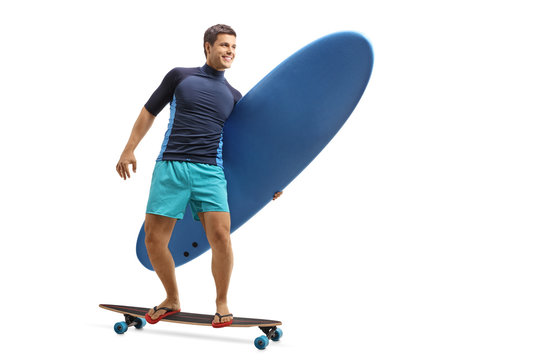 Surfer with a surfboard riding a longboard