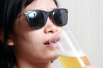 The woman drinking beer