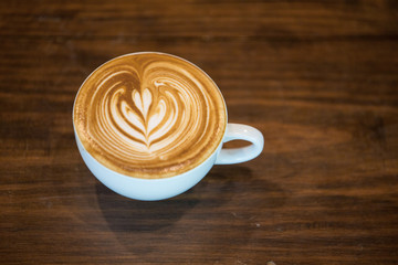 Coffee latte art  Selective focus white cup.color vintage style.