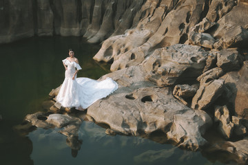 Portrait of asian bride on the rock