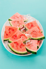 Fresh watermelon slices on ice cubes