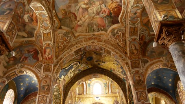 The vault decorated with beautiful Byzantine mosaics of the 12th century and the newer part is decorated with later frescoes the 18th century in the Martorana church.