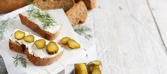 Sandwiches with cream cheese, dill and salted cucumber