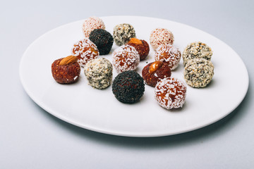 sweets from dried fruits with nuts and sesame seeds