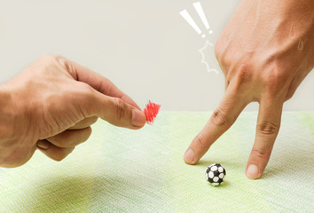 Playing socker made by paper with  fingers,Use fings show red cards to player,Dangerous while...