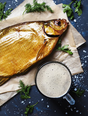 Frothy beer with smoked bream, top view