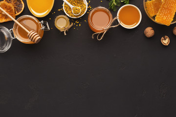 Various types of honey on wooden platter