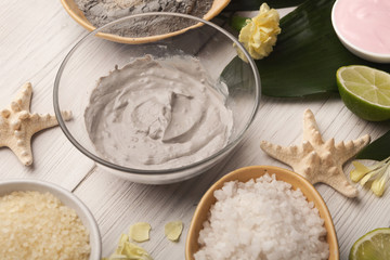 Mud mask emultion on white wooden table