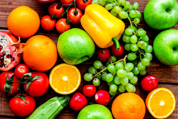 fruits and vegetables for healthy dinner on wooden background to