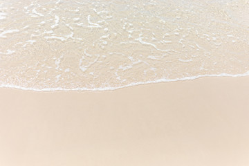 Fototapeta na wymiar Empty beautiful top view soft wave of sea water ocean on sandy tropical beach background. copy space