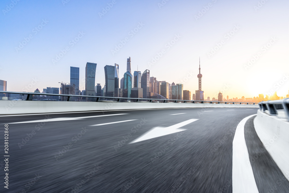 Wall mural empty asphalt road with office building