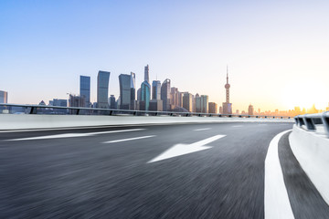 empty asphalt road with office building