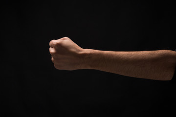 Hand gesture, man clenched fist, ready to punch isolated