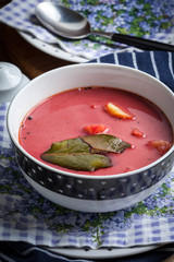 Vegetarian red soup - borsch in green bowl.